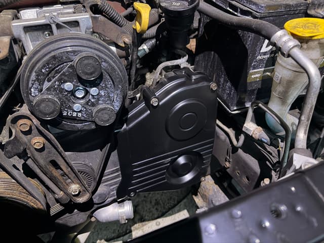 Replacing the timing belt cover that was damaged from the wreck — photo 2