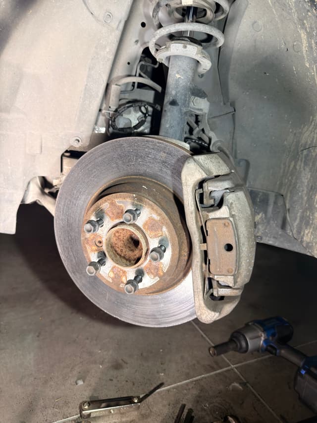 Old owner drove the brakes till it ground the sensor into dust. Replaced the pads and sensor. — photo 3