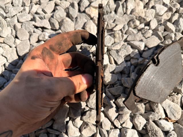 Old owner drove the brakes till it ground the sensor into dust. Replaced the pads and sensor. — photo 6